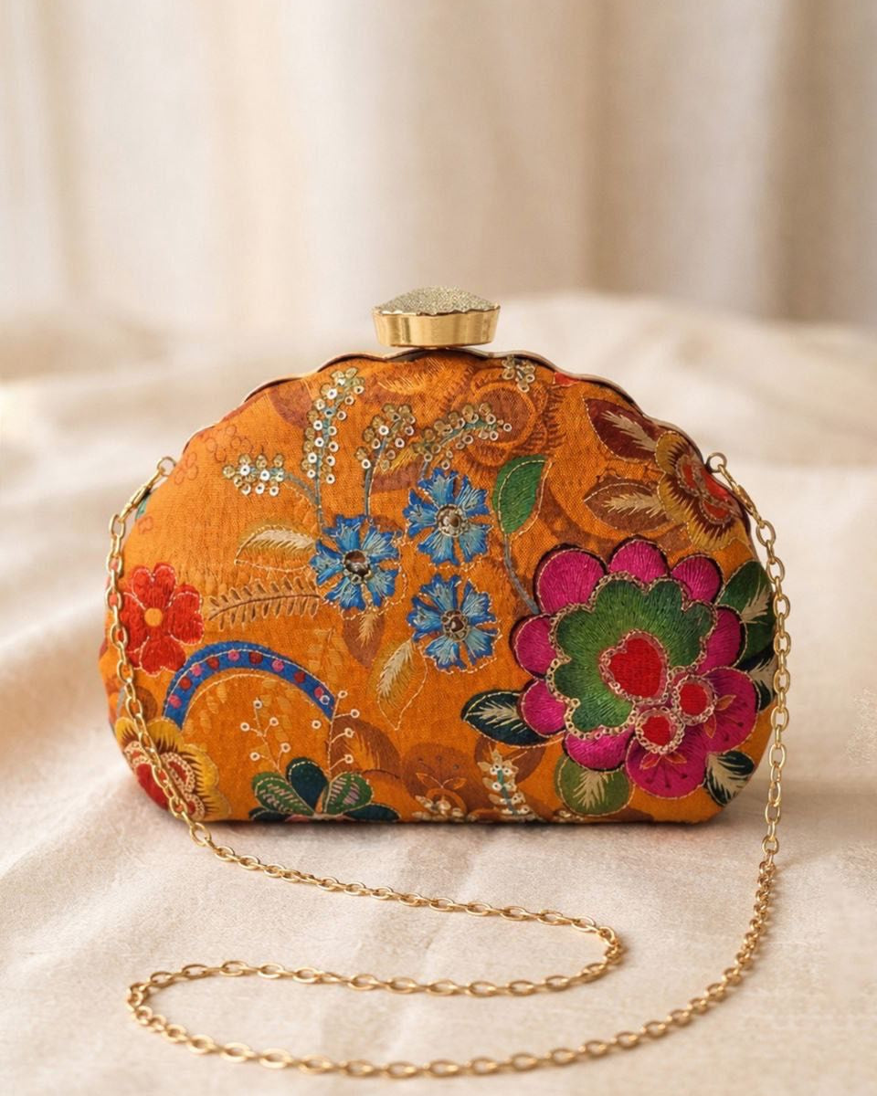 Decorative clutch bag with floral patterns on a beige background
