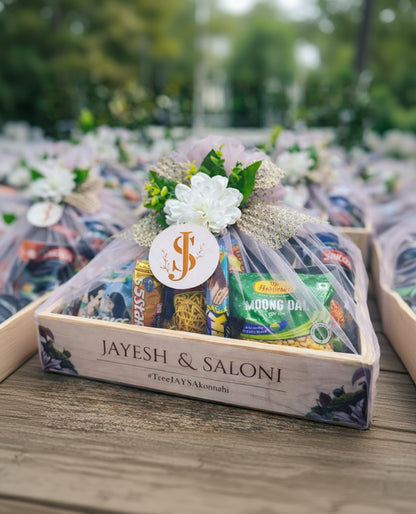 Personalized Wedding Welcome Hampers in Custom Wooden Trays with Elegant Floral Net Wrapping
